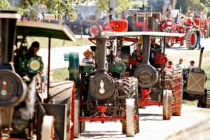 Bob Gallo, center, operates a 1913 Case steam traction engine, featuring a 50 horsepower engine with an operating weight of near 20,000 pounds, on Sept. 11th during the Parade of Power. The Missouri River Valley Steam Engine Association puts on the annual Back to the Farm show which celebrates early American agriculture.